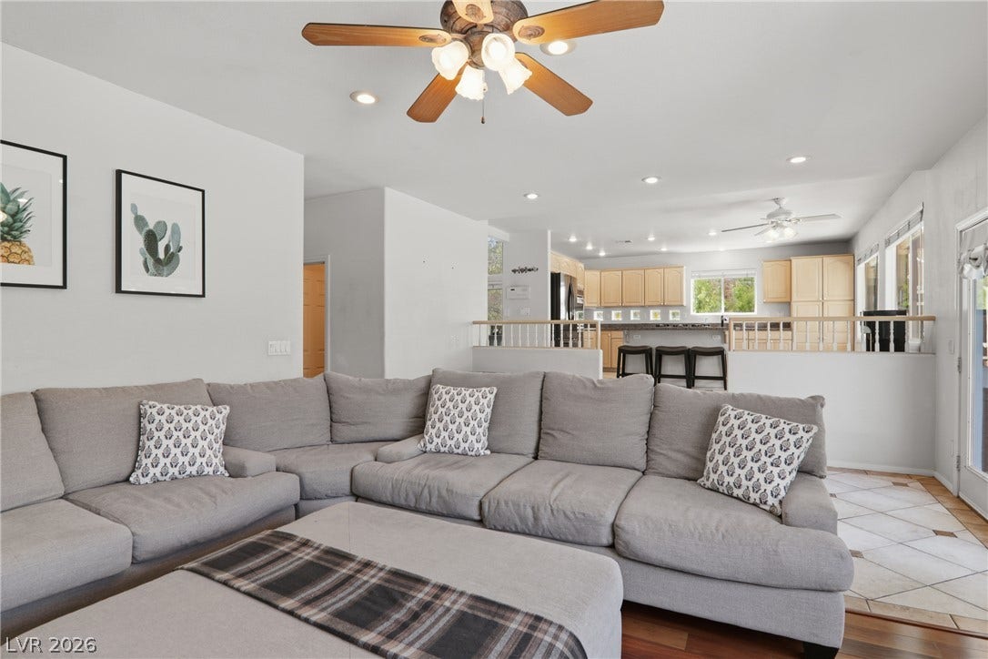 2218 Alanhurst Drive, Henderson, NV 89052 A split-level layout connects the inviting living room to a functional kitchen with a breakfast bar.