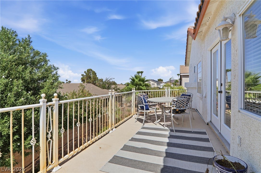 2218 Alanhurst Drive, Henderson, NV 89052 An inviting private patio balcony offers ample space for outdoor dining and enjoying neighborhood views.