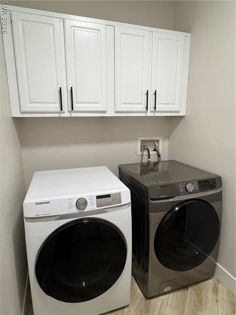 9621 Dancing Pond Way, Las Vegas, NV 89178 A dedicated laundry space offers stacked appliances and ample storage for a highly efficient home.