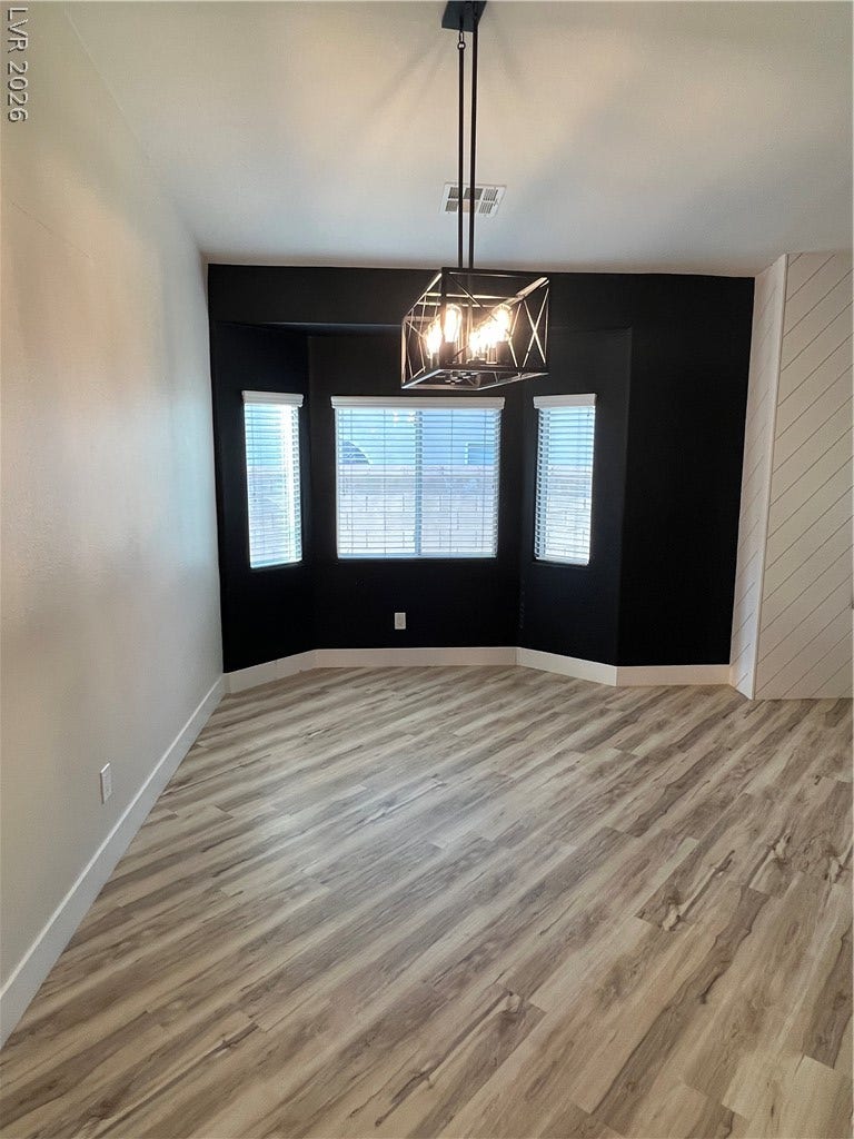 9621 Dancing Pond Way, Las Vegas, NV 89178 Enter through a distinctive doorway illuminated by a stylish geometric light fixture.