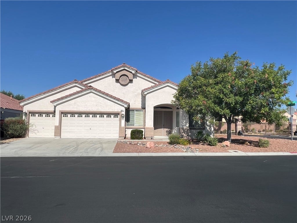 9621 Dancing Pond Way, Las Vegas, NV 89178 A well-maintained stucco exterior home with a two-car garage and mature landscaping.