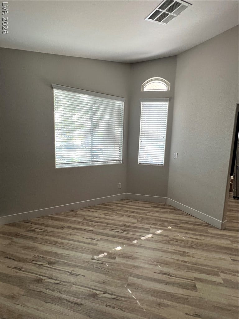 9621 Dancing Pond Way, Las Vegas, NV 89178 Natural light filters through the well-placed windows, highlighting the durable, attractive flooring.