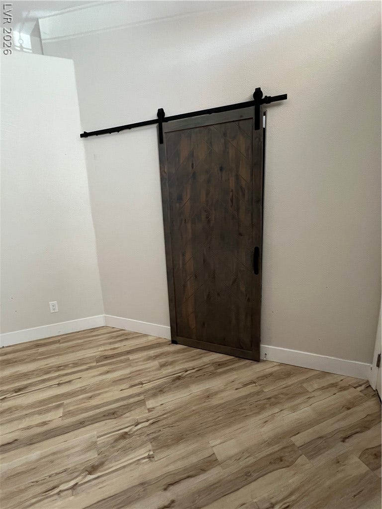 9621 Dancing Pond Way, Las Vegas, NV 89178 Rich wood plank flooring sets a warm foundation in this inviting room.
