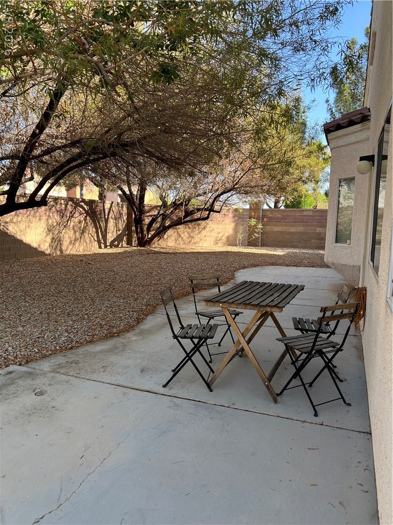 9621 Dancing Pond Way, Las Vegas, NV 89178 A spacious backyard patio provides ample space for outdoor dining and relaxation.