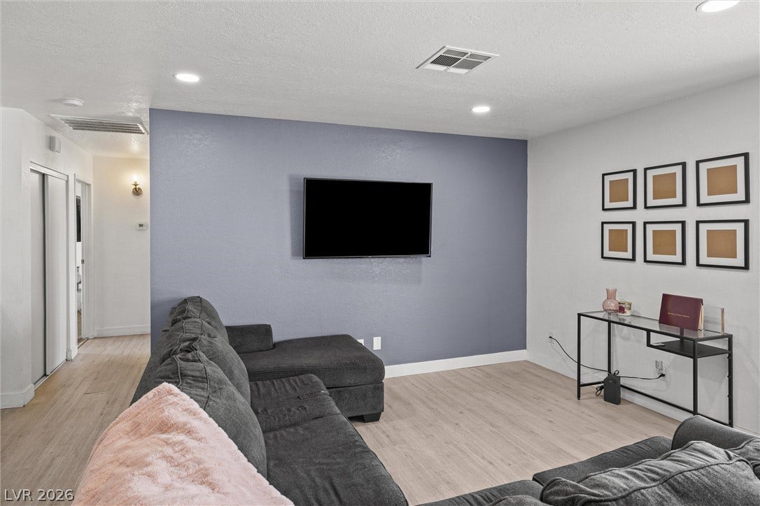 525 Van Dornum Avenue, Henderson, NV 89011 Recessed lighting illuminates a comfortable living space with light-toned flooring.