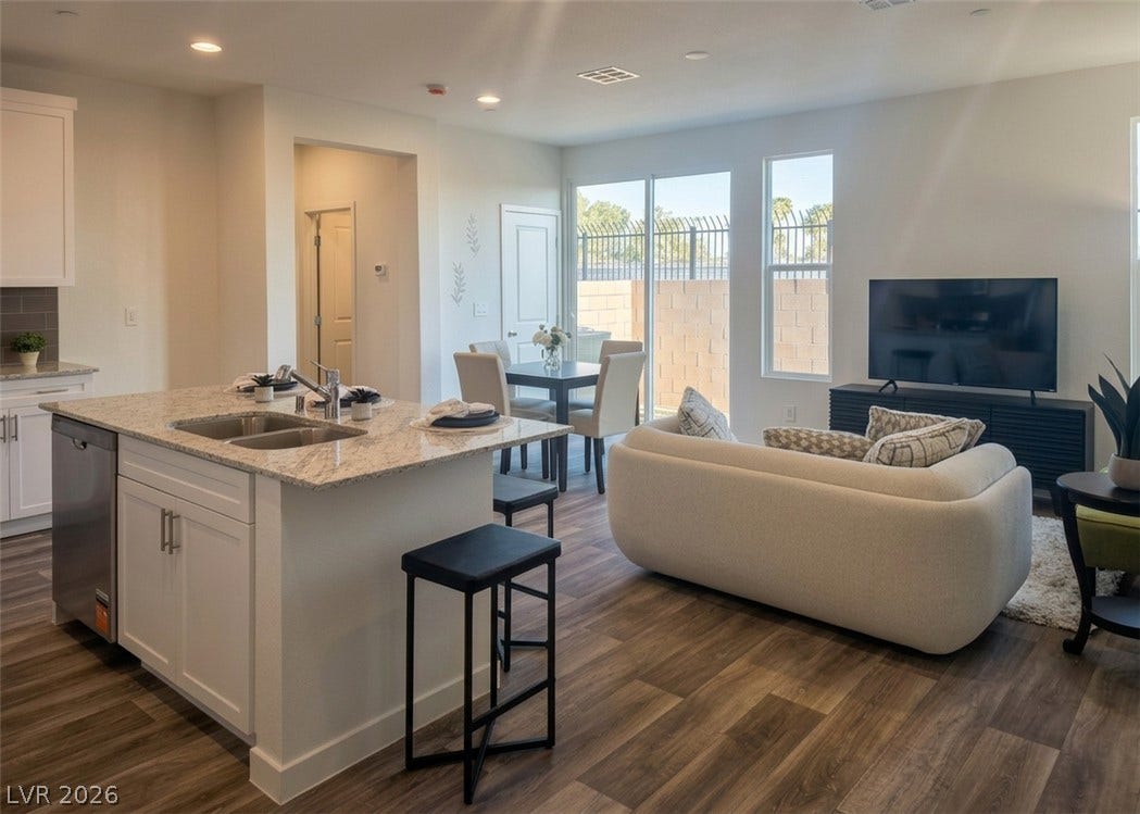 4926 Sweet Vesper Court, Las Vegas, NV 89108 An open floor plan connects the kitchen island to the bright living space.