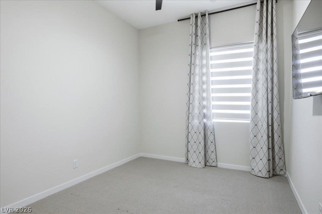 847 Eaton Falls Street, Henderson, NV 89011 An inviting room features plush carpeting and abundant natural light filtering through modern window treatments.