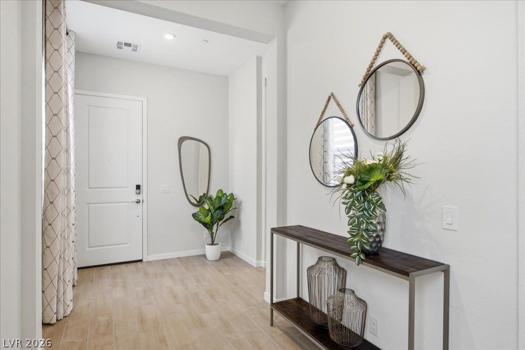 847 Eaton Falls Street, Henderson, NV 89011 An inviting entry presents light wood flooring and a clean, neutral color palette.