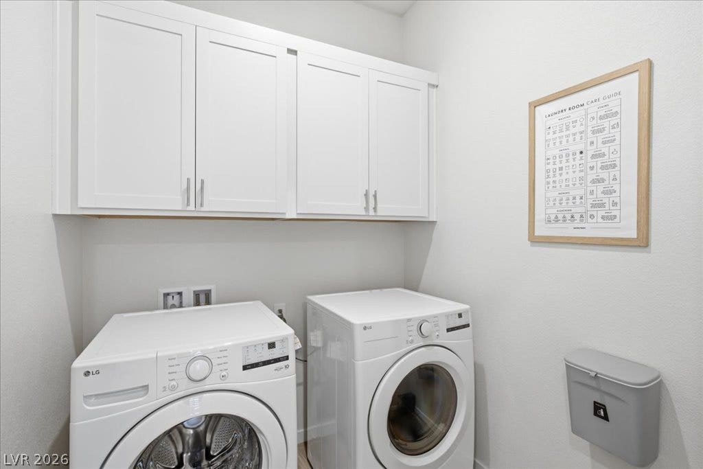 847 Eaton Falls Street, Henderson, NV 89011 Functional laundry space featuring modern appliances and convenient overhead cabinetry.