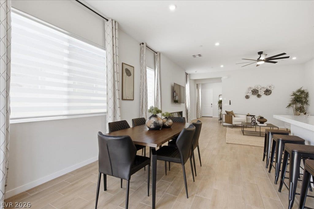 847 Eaton Falls Street, Henderson, NV 89011 Natural light filters into this open-concept dining area featuring durable tile flooring.