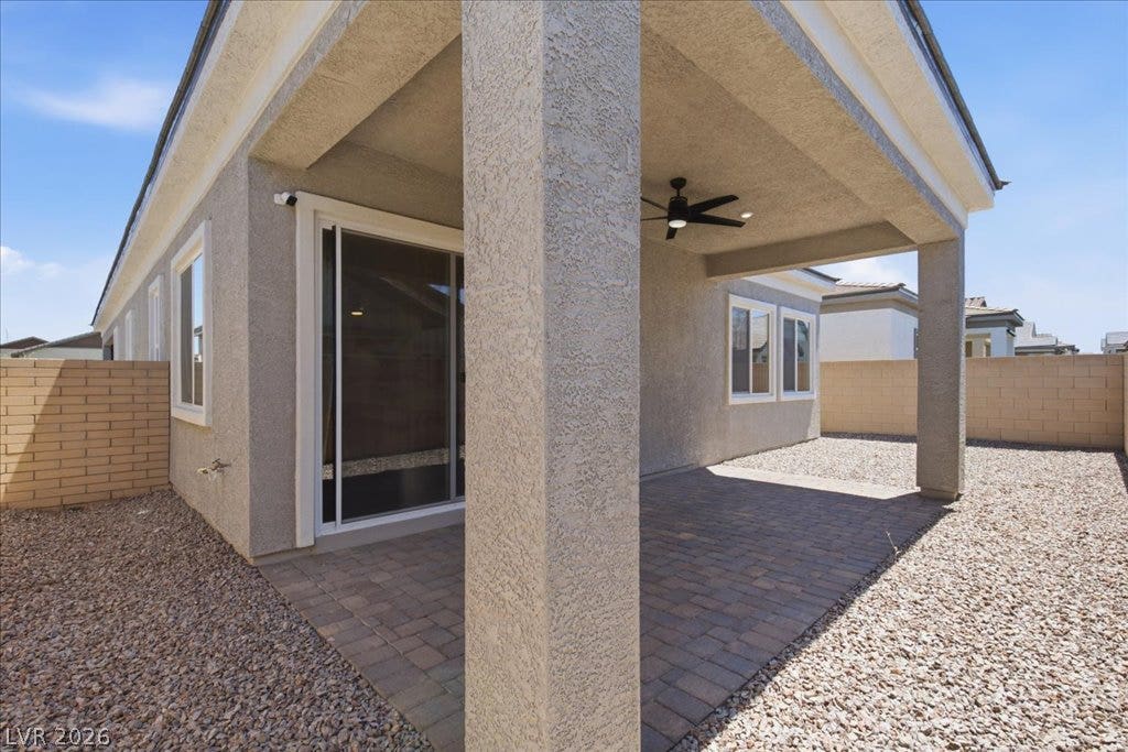 847 Eaton Falls Street, Henderson, NV 89011 An inviting covered patio offers a comfortable outdoor living space with durable pavers and a private, low-maintenance yard.