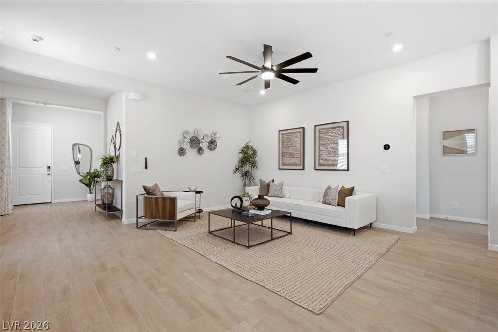 847 Eaton Falls Street, Henderson, NV 89011 A naturally illuminated living area features light-toned flooring, clean walls, and modern decor.