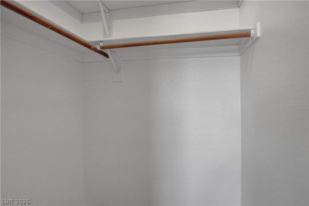 8308 Raphael Court, Las Vegas, NV 89129 Functional closet space offers ample storage with convenient shelving and hanging rods.