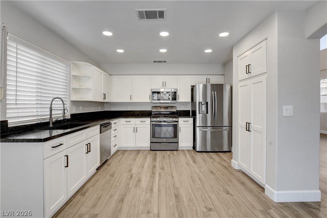 8308 Raphael Court, Las Vegas, NV 89129 A well-appointed kitchen showcases sleek stainless steel appliances and abundant cabinetry, perfect for culinary pursuits.