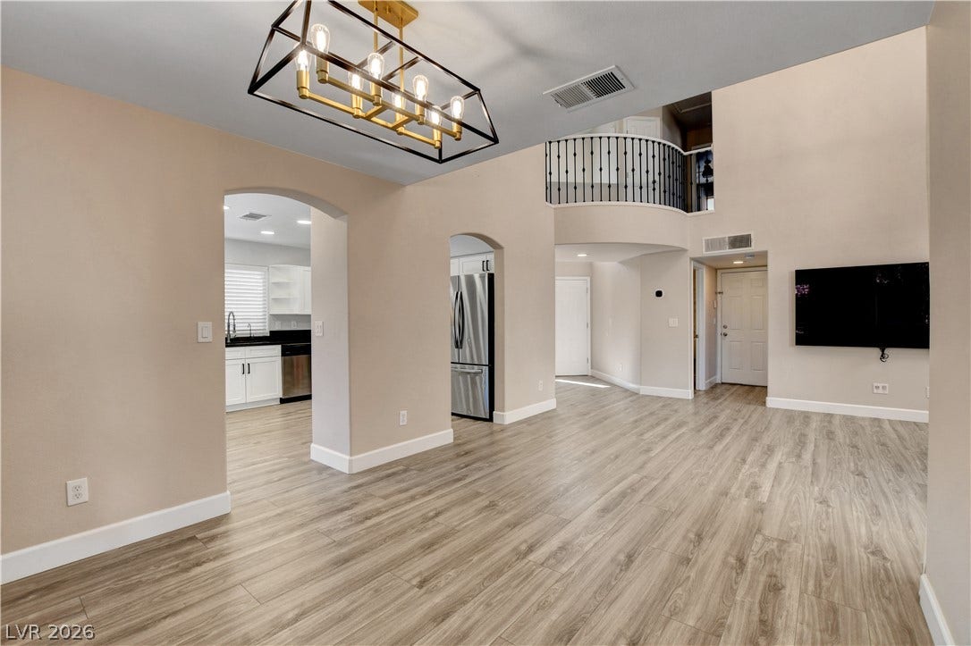 8308 Raphael Court, Las Vegas, NV 89129 An open-concept living space presents a flowing layout, high ceilings, and a well-lit interior, perfect for entertaining.