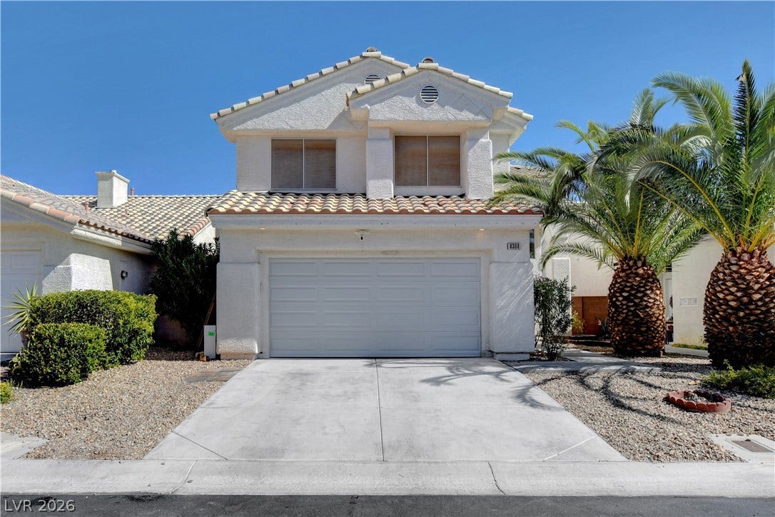 8308 Raphael Court, Las Vegas, NV 89129 A well-maintained facade features a two-car garage, mature landscaping, and a welcoming entry.