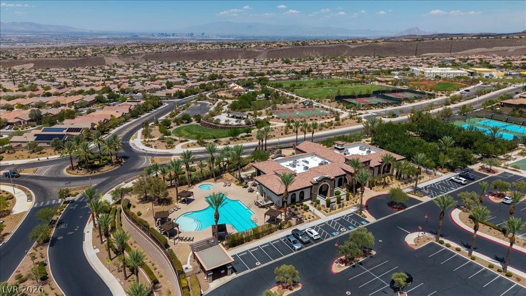 2828 Josephine Drive, Henderson, NV 89044 An aerial perspective reveals a vibrant community with a grand clubhouse, inviting pool, and extensive recreational facilities.