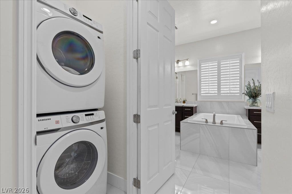 2828 Josephine Drive, Henderson, NV 89044 A well-appointed laundry area is conveniently located beside a luxurious bathroom with a deep soaking tub and stylish vanity.