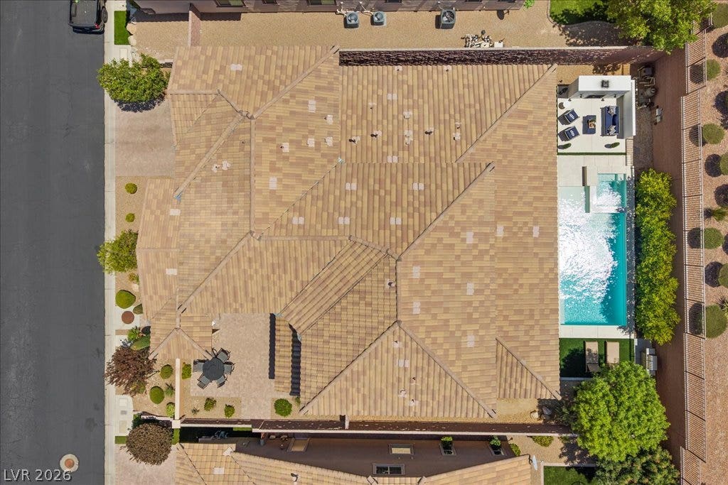 2828 Josephine Drive, Henderson, NV 89044 An aerial perspective reveals a private yard with a refreshing pool, ample patio space, and mature landscaping.