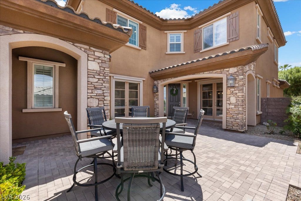 2828 Josephine Drive, Henderson, NV 89044 A private outdoor patio with stone pavers offers an inviting space for relaxation and al fresco dining.