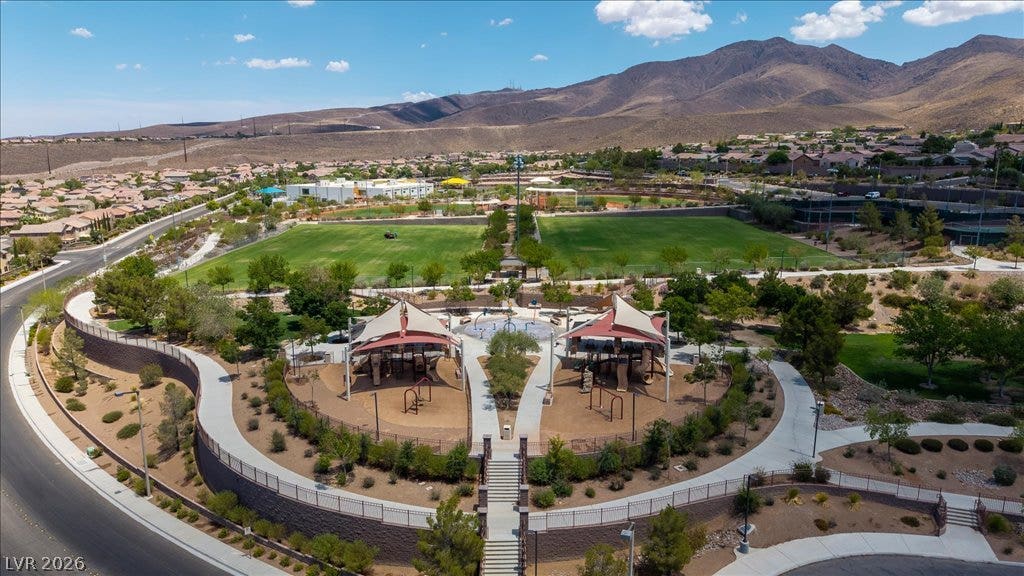 2828 Josephine Drive, Henderson, NV 89044 Vast green spaces and a vibrant playground await within this master-planned community against a mountain backdrop.