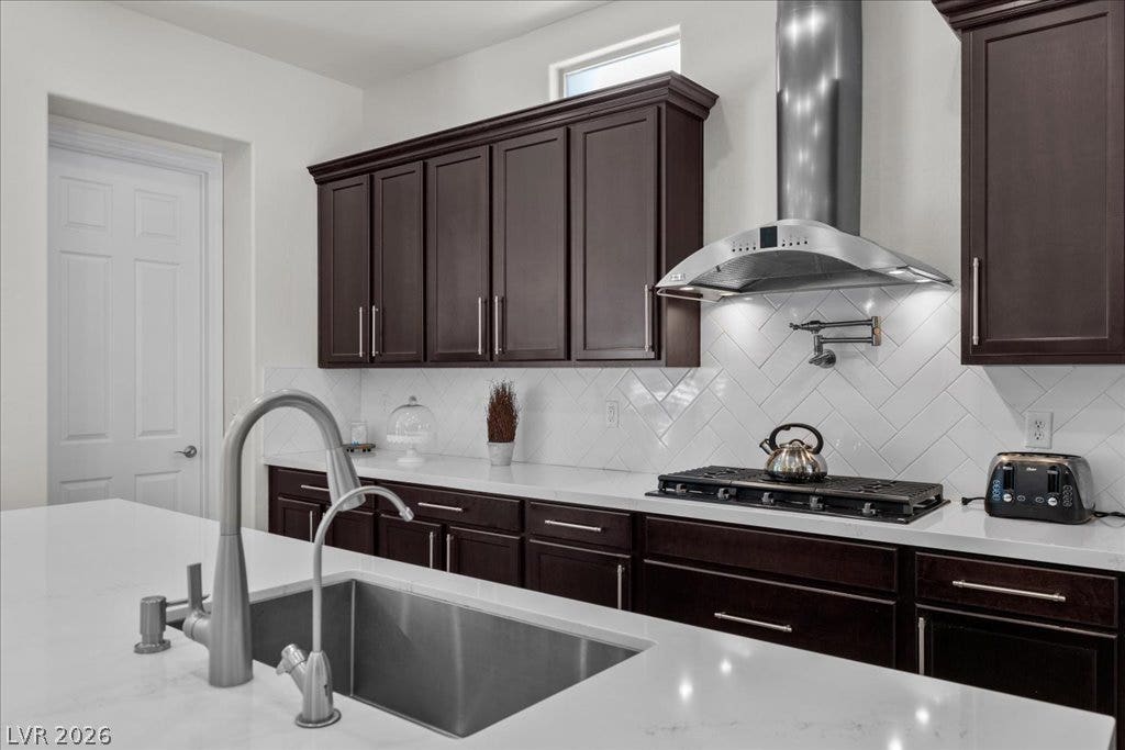 2828 Josephine Drive, Henderson, NV 89044 Culinary delights await in this modern kitchen with rich cabinetry and an expansive island sink.