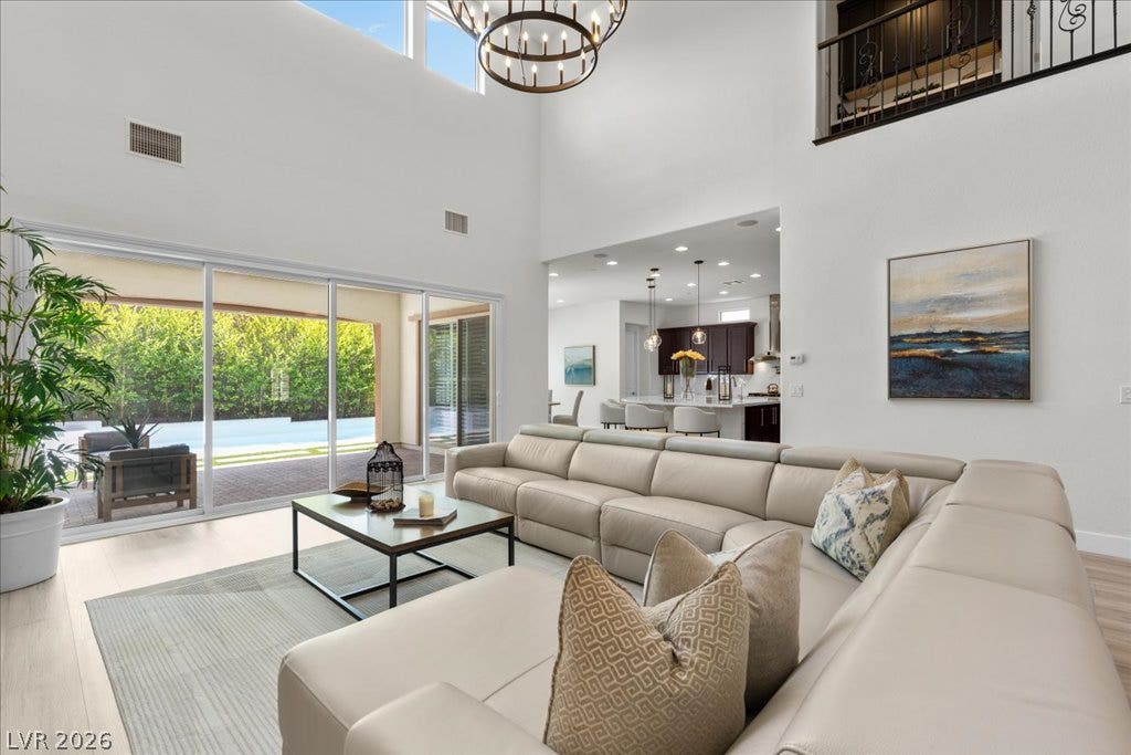 2828 Josephine Drive, Henderson, NV 89044 Lofty ceilings and sun-filled interiors define this inviting living area, seamlessly transitioning to a private outdoor oasis.