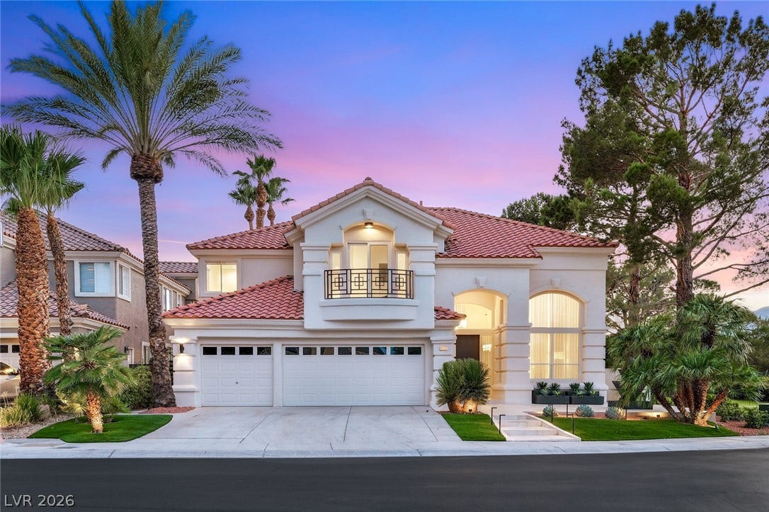 An inviting entry and well-maintained front yard complement this elegant residence with a private balcony.