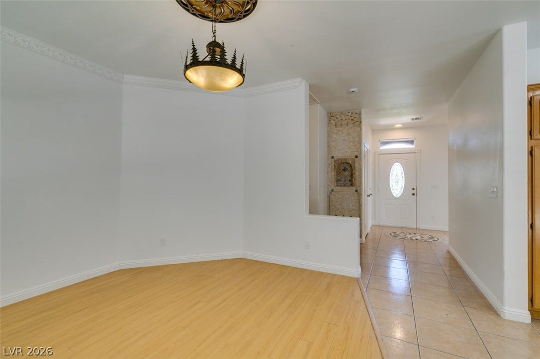 10513 Shanna Trellis Avenue, Las Vegas, NV 89144 Foyer entrance featuring light wood-style floors and baseboards