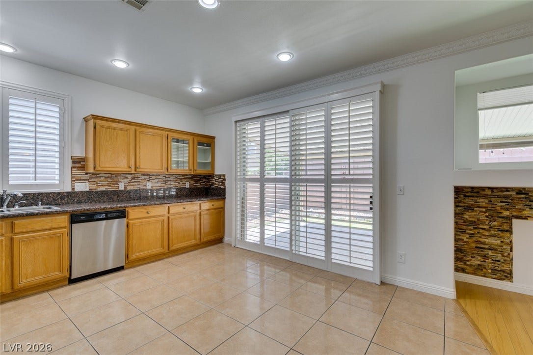 10513 Shanna Trellis Avenue, Las Vegas, NV 89144 Kitchen featuring dishwasher, light tile patterned flooring, decorative backsplash, brown cabinets, and recessed lighting