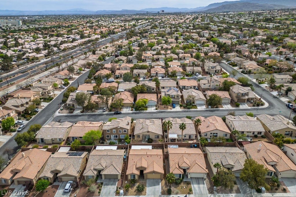 10513 Shanna Trellis Avenue, Las Vegas, NV 89144 Aerial view of property's location with a mountainous background and nearby suburban area