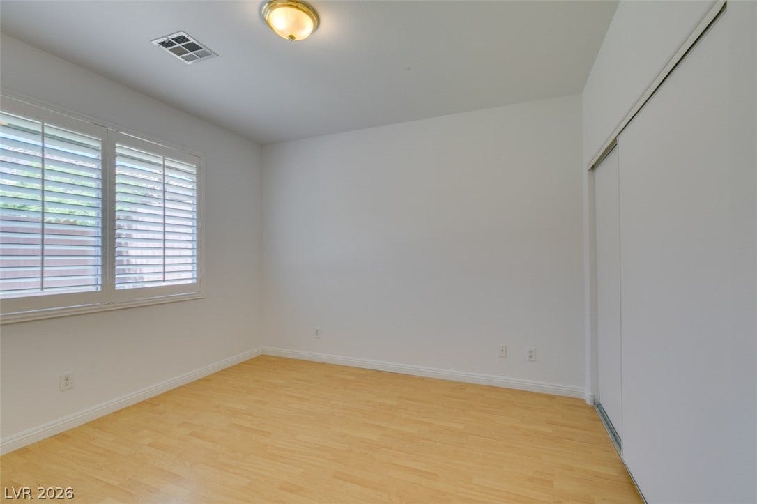10513 Shanna Trellis Avenue, Las Vegas, NV 89144 Spare room with light wood-type flooring and baseboards