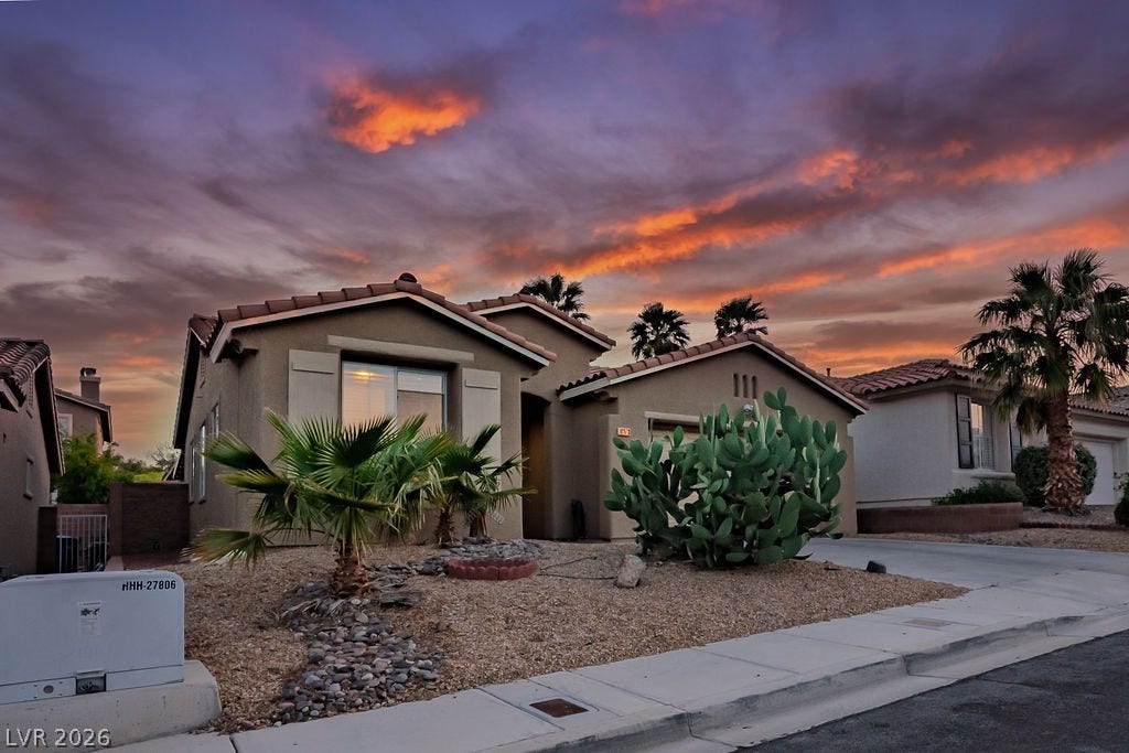 10513 Shanna Trellis Avenue, Las Vegas, NV 89144 Mediterranean / spanish house with stucco siding, a tiled roof, a garage, and driveway