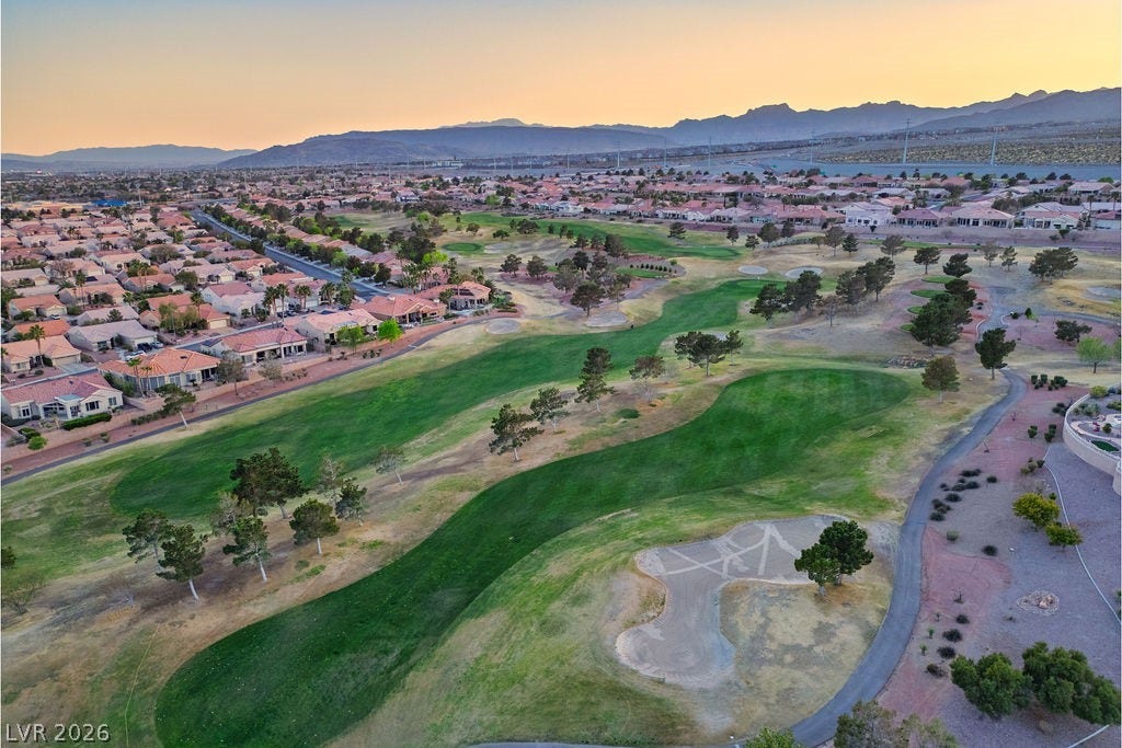 10513 Shanna Trellis Avenue, Las Vegas, NV 89144 Aerial view at dusk of a residential view, golf course view, and a mountain view