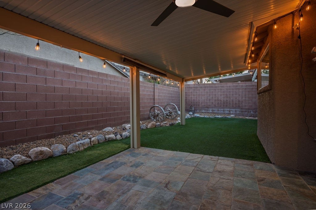 10513 Shanna Trellis Avenue, Las Vegas, NV 89144 Fenced backyard with ceiling fan and a patio