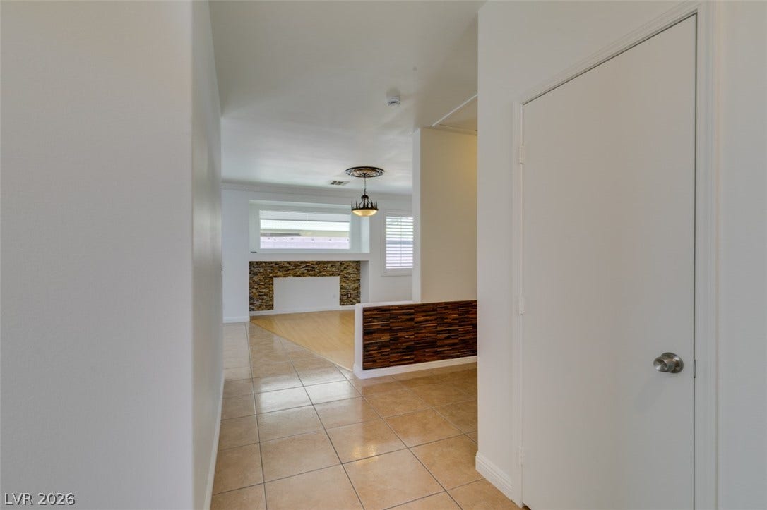10513 Shanna Trellis Avenue, Las Vegas, NV 89144 Hall with light tile patterned floors and baseboards