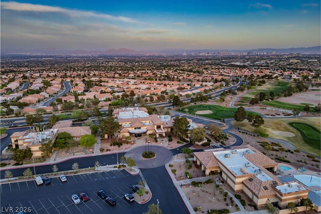 10513 Shanna Trellis Avenue, Las Vegas, NV 89144 Aerial view at dusk of golf course view, a mountain view, and a residential view
