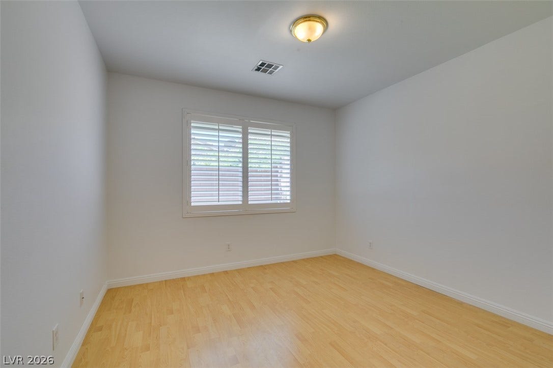 10513 Shanna Trellis Avenue, Las Vegas, NV 89144 Unfurnished room featuring light wood-type flooring and baseboards