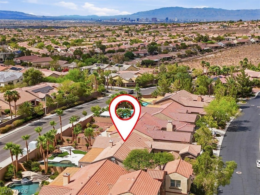 Scenic neighborhood panoramas unfold from this elevated vantage point showcasing tiled roofs and distant mountains.