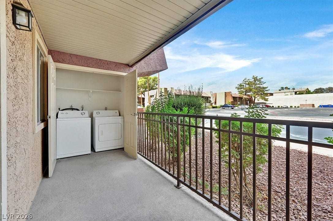 5081 River Glen Drive, #97, Las Vegas, NV 89103 An outdoor laundry closet sits on a covered balcony overlooking the surrounding neighborhood.