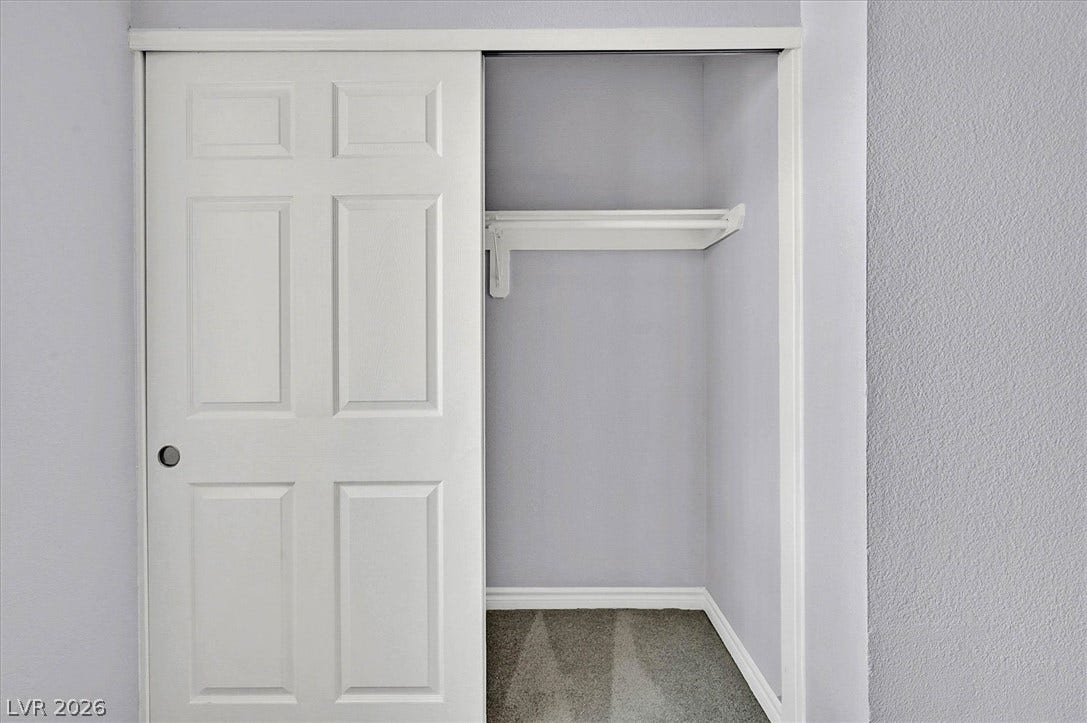 5081 River Glen Drive, #97, Las Vegas, NV 89103 A sliding door opens to reveal functional closet storage with built-in shelving.