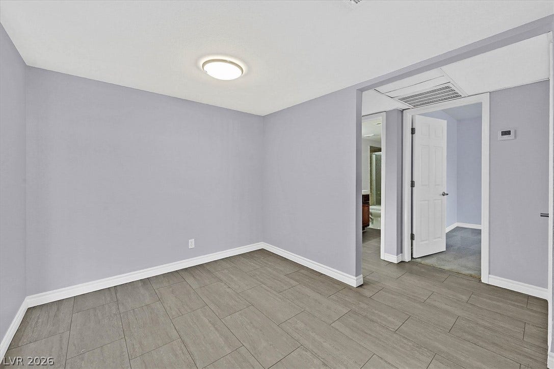 5081 River Glen Drive, #97, Las Vegas, NV 89103 Vinyl flooring and clean white baseboards define this versatile dining area.