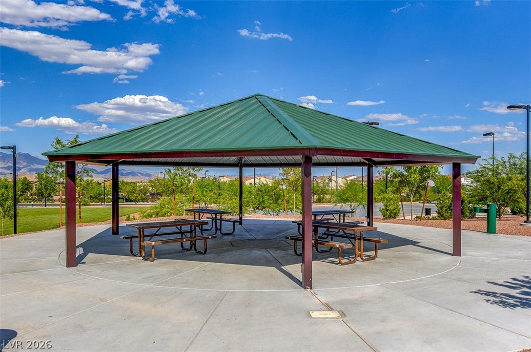 9928 Tradition Creek Avenue, Las Vegas, NV 89149 An inviting community pavilion with picnic tables offers a perfect spot for outdoor gatherings.