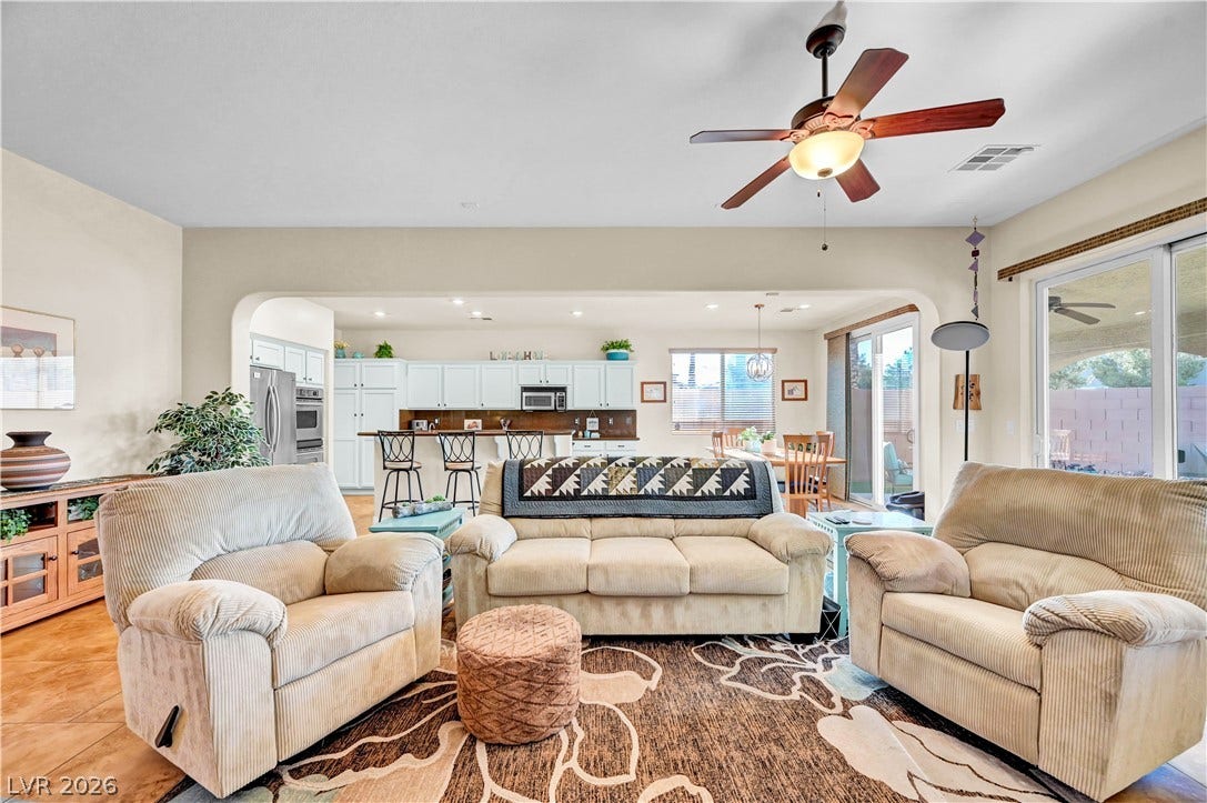 9928 Tradition Creek Avenue, Las Vegas, NV 89149 An inviting open-concept layout connects the living area to a spacious kitchen and dining nook.