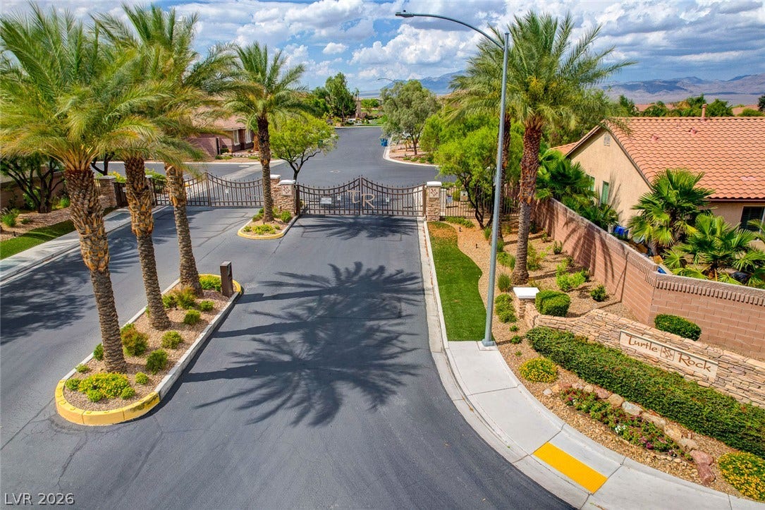 9928 Tradition Creek Avenue, Las Vegas, NV 89149 Palm-lined streets greet residents at the impressive, gated entrance of this community.