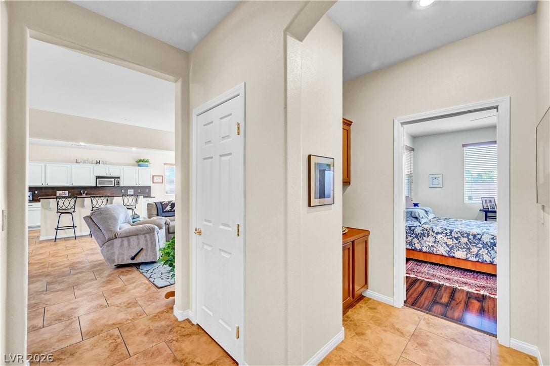 9928 Tradition Creek Avenue, Las Vegas, NV 89149 A well-lit interior entryway reveals seamless transitions between living spaces.