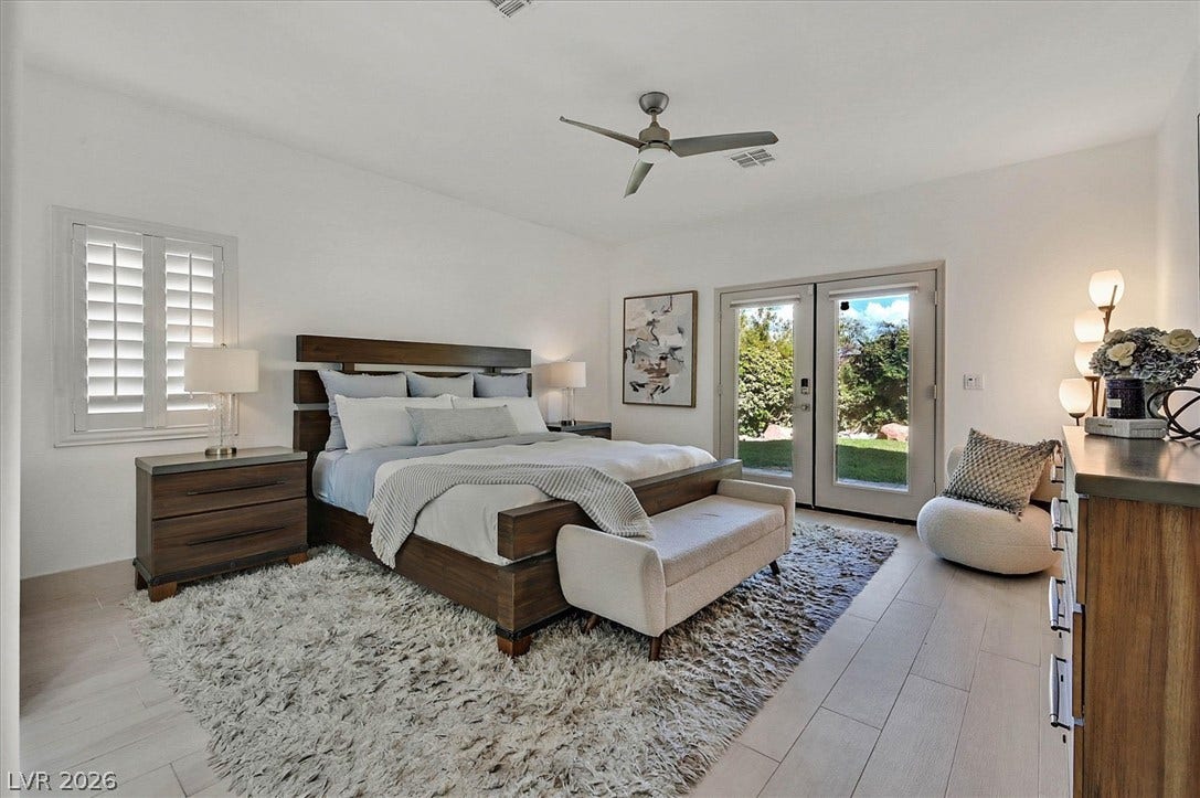 Bedroom oasis with direct outdoor access and light flooring.