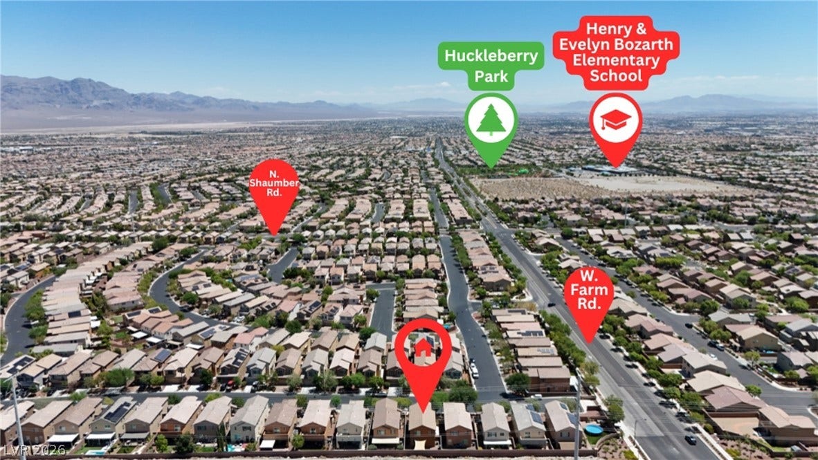 An aerial perspective showcases a residential neighborhood amidst a vast, arid landscape, highlighting key community features.