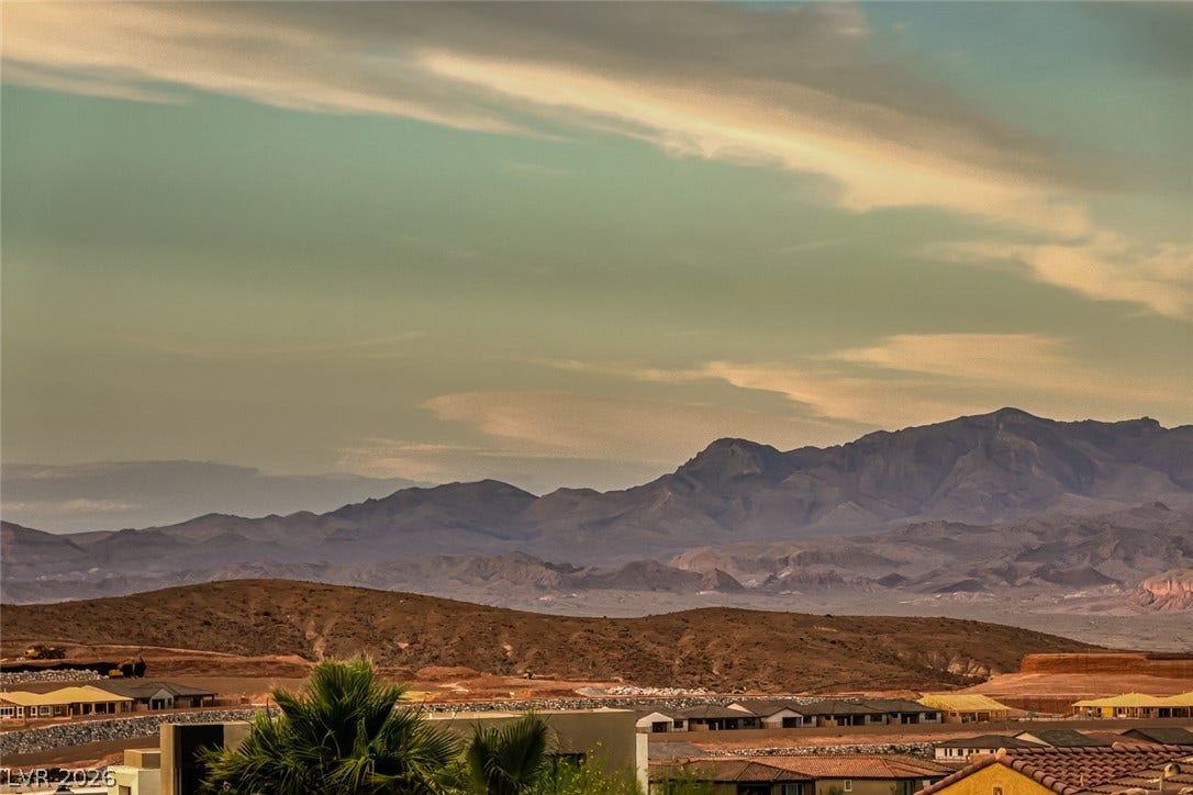 70 Portezza Drive, Henderson, NV 89011 Panoramic mountain views highlight this scenic residential area, offering a tranquil backdrop for desert living.