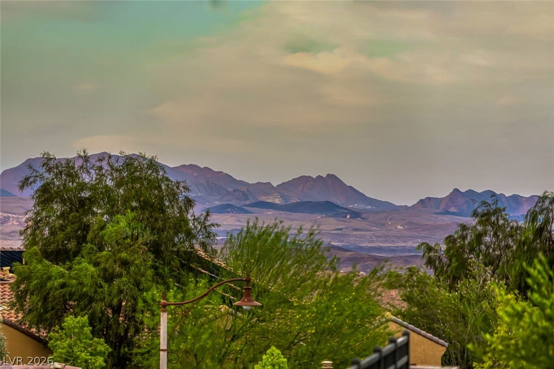 70 Portezza Drive, Henderson, NV 89011 Breathtaking mountain panoramas stretch across the horizon, offering a serene backdrop to this property.